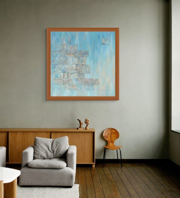 Framed painting of the Western Wall in calming blue tones with ancient stones floating in space, symbolizing prayer, resilience, and the eternal bond between earth and heaven, displayed in a modern interior