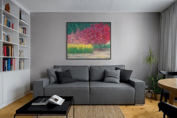 Framed painting of Jerusalem in spring with bright pink blossoms on trees and yellow flowers on the ground, symbolizing renewal and sacred energy, displayed in a modern interior
