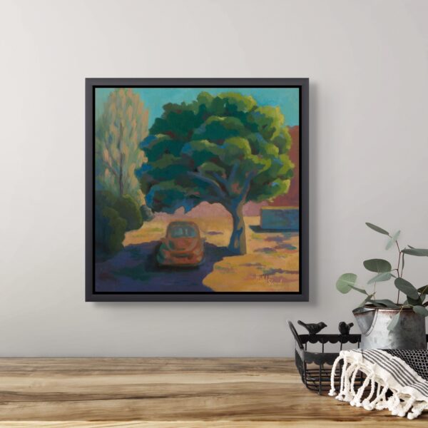 Framed painting of a car parked under a ficus tree on a hot summer day, displayed in a modern interior with wooden table and plant décor