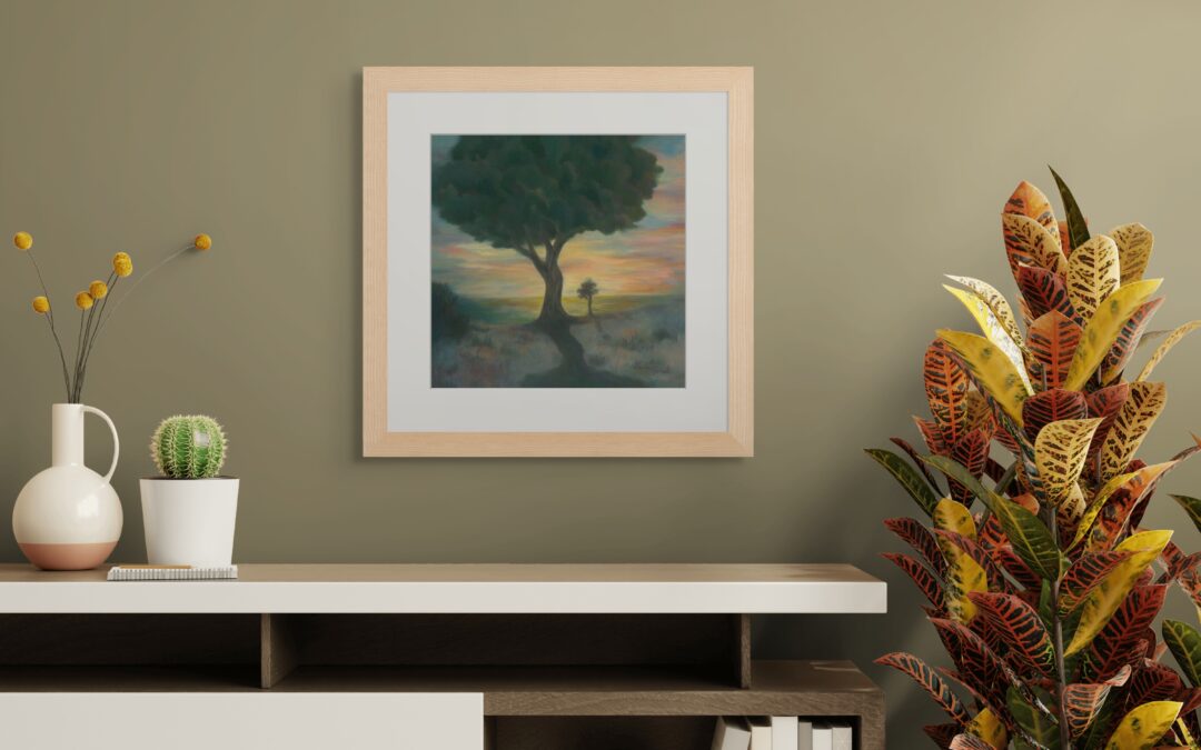 Framed painting of a large tree at sunset with warm glowing light, creating a serene and reflective atmosphere in a modern interior.