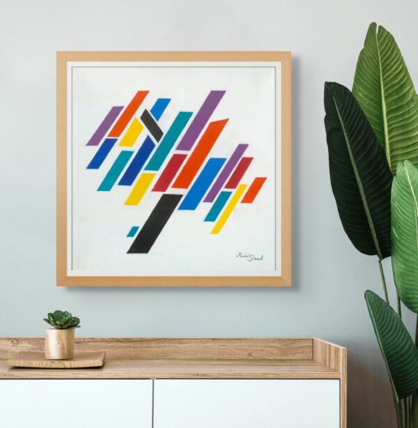 Framed abstract tree artwork made of colorful parallelograms, displayed on a modern cabinet with indoor plants